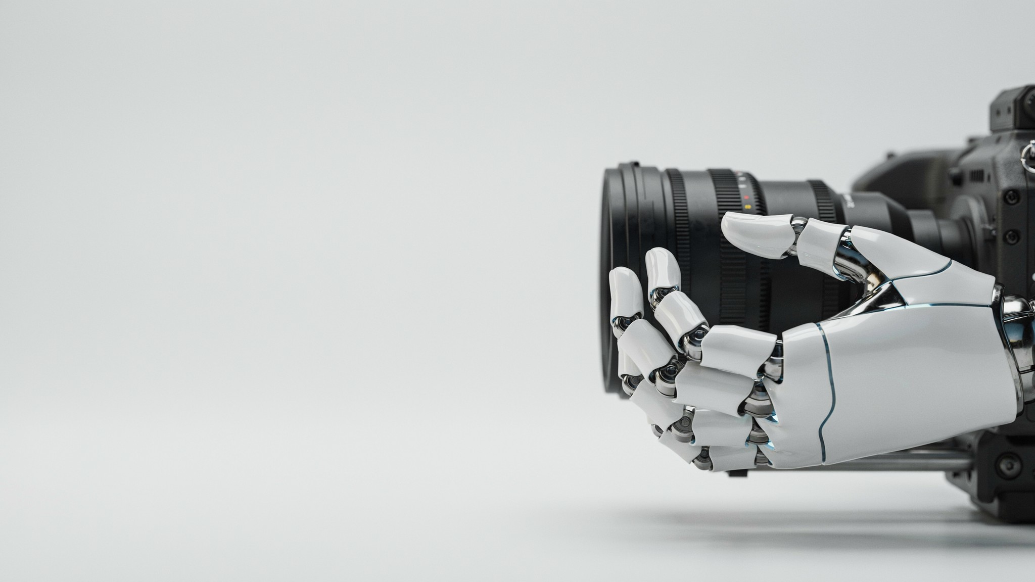 Robotic hand adjusting a cinema camera focus ring — brand videography and video production